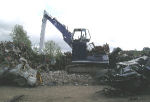 grab working at metal recycling plant
